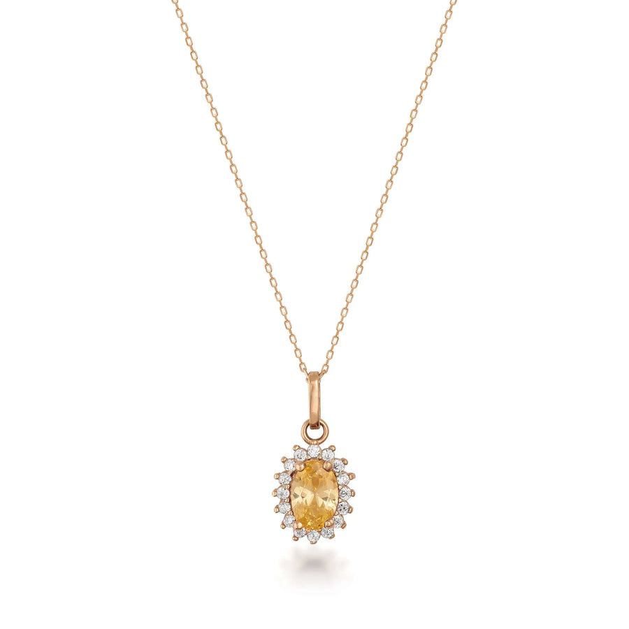 Collana con ciondolo halo in oro rosa 14kt con citrino creato in laboratorio su sfondo bianco
