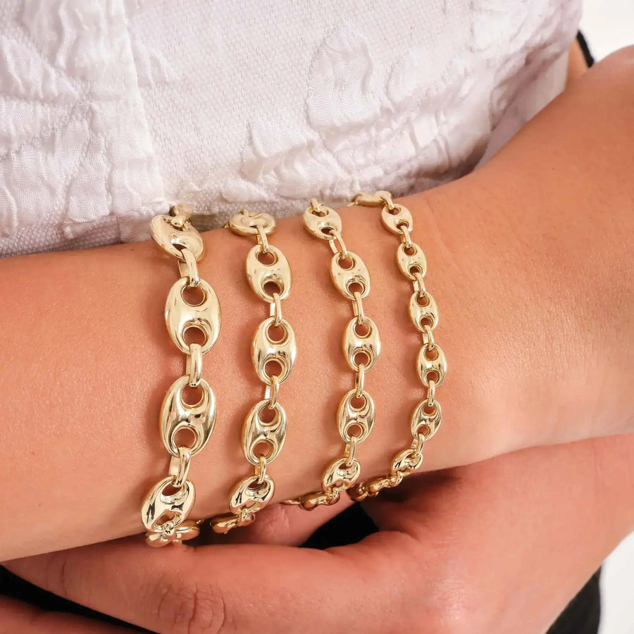 Bracciali a maglia marina in oro giallo 14kt sovrapposti al polso