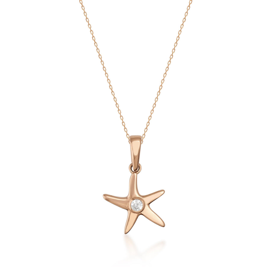 Collier pendentif étoile de mer en or rose 14 carats avec centre en oxyde de zirconium sur fond blanc