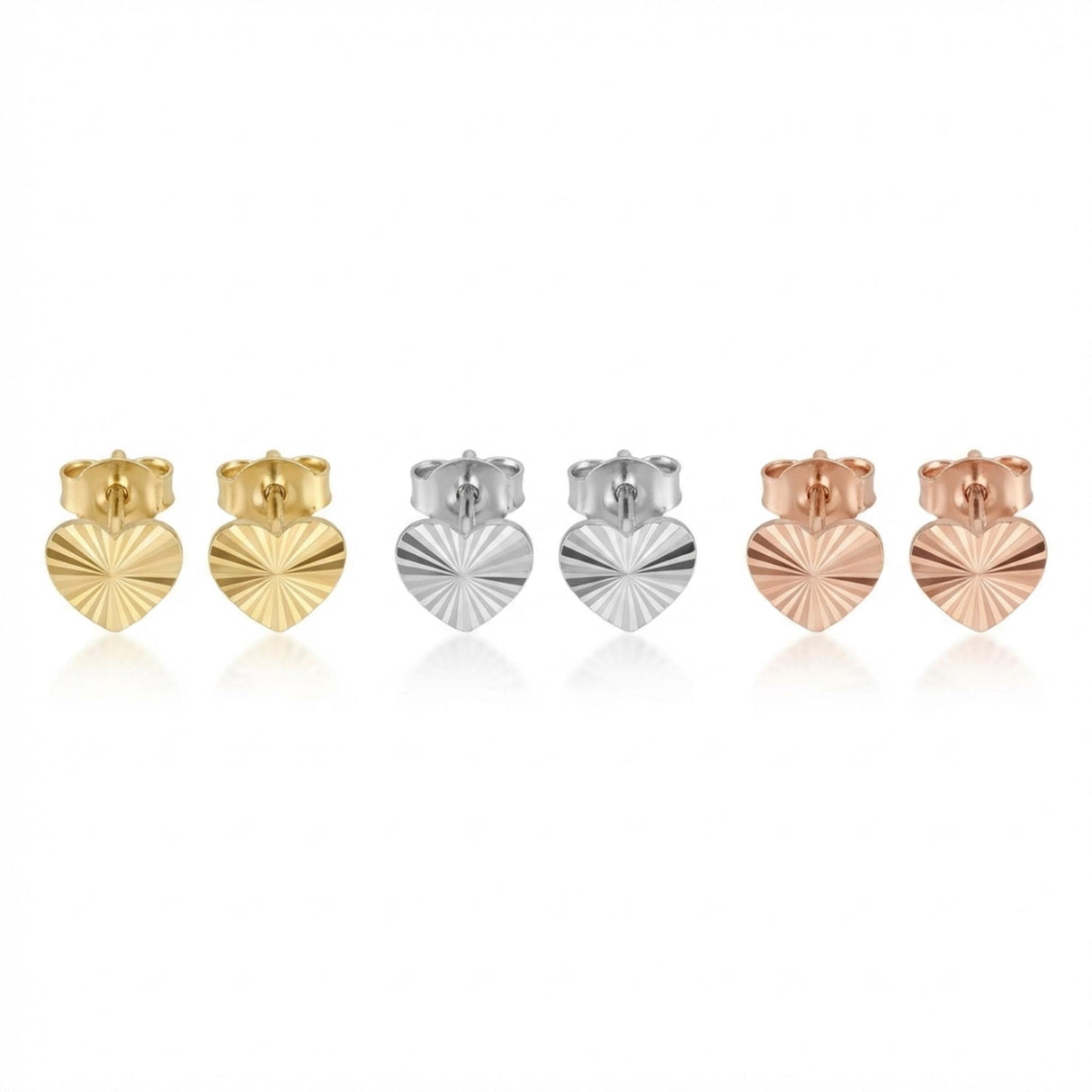 14K yellow, white and rose gold diamond-cut heart stud earrings side by side on white