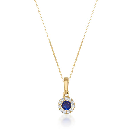 Collier halo saphir rond de synthèse en or jaune 14 carats sur fond blanc