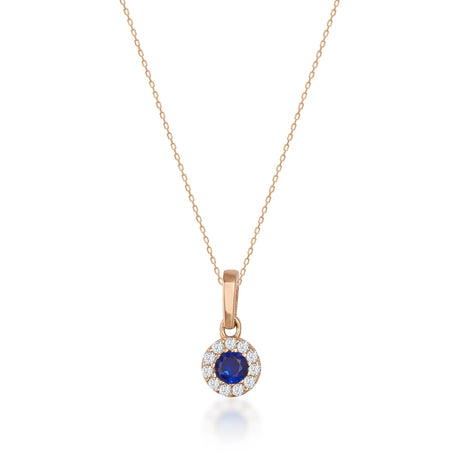 Collier halo saphir rond de synthèse en or rose 14 carats sur fond blanc