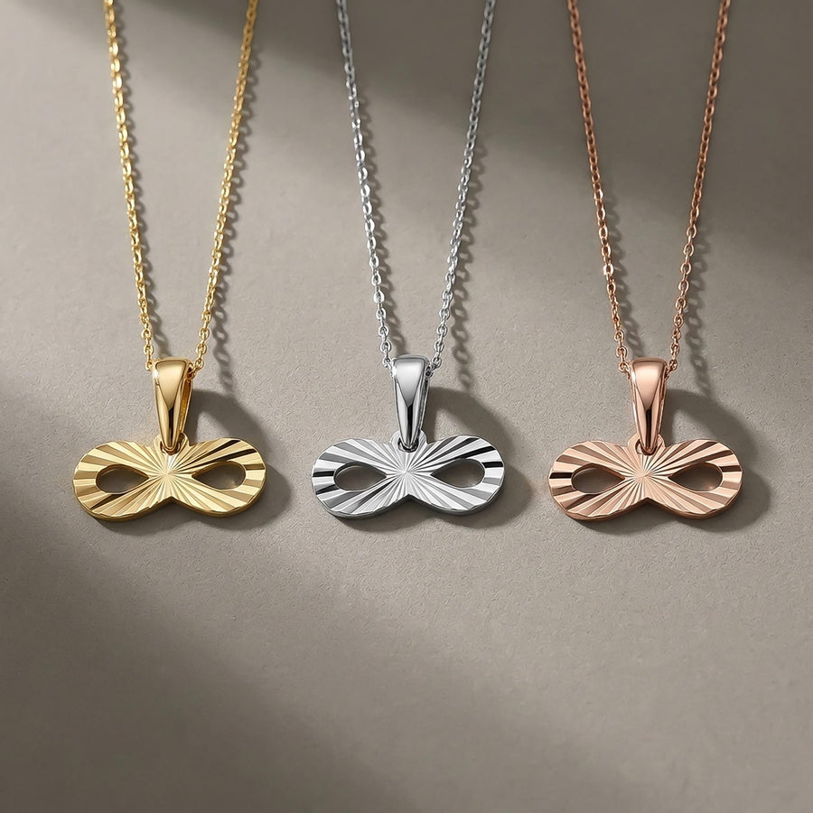 14K yellow, white and rose gold diamond-cut infinity pendants side by side