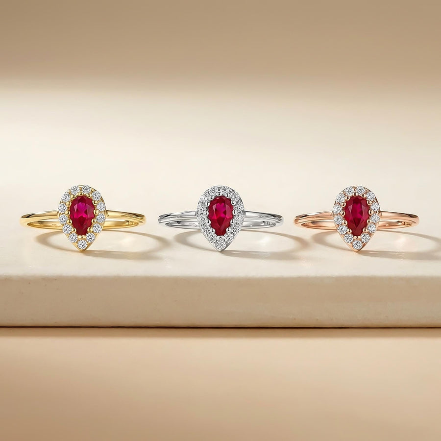 Lab-grown ruby pear halo rings in 14K yellow, white and rose gold