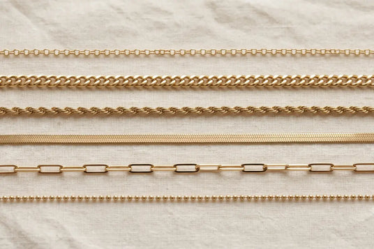 Six 14K gold chain link styles including cable, curb, rope, and herringbone