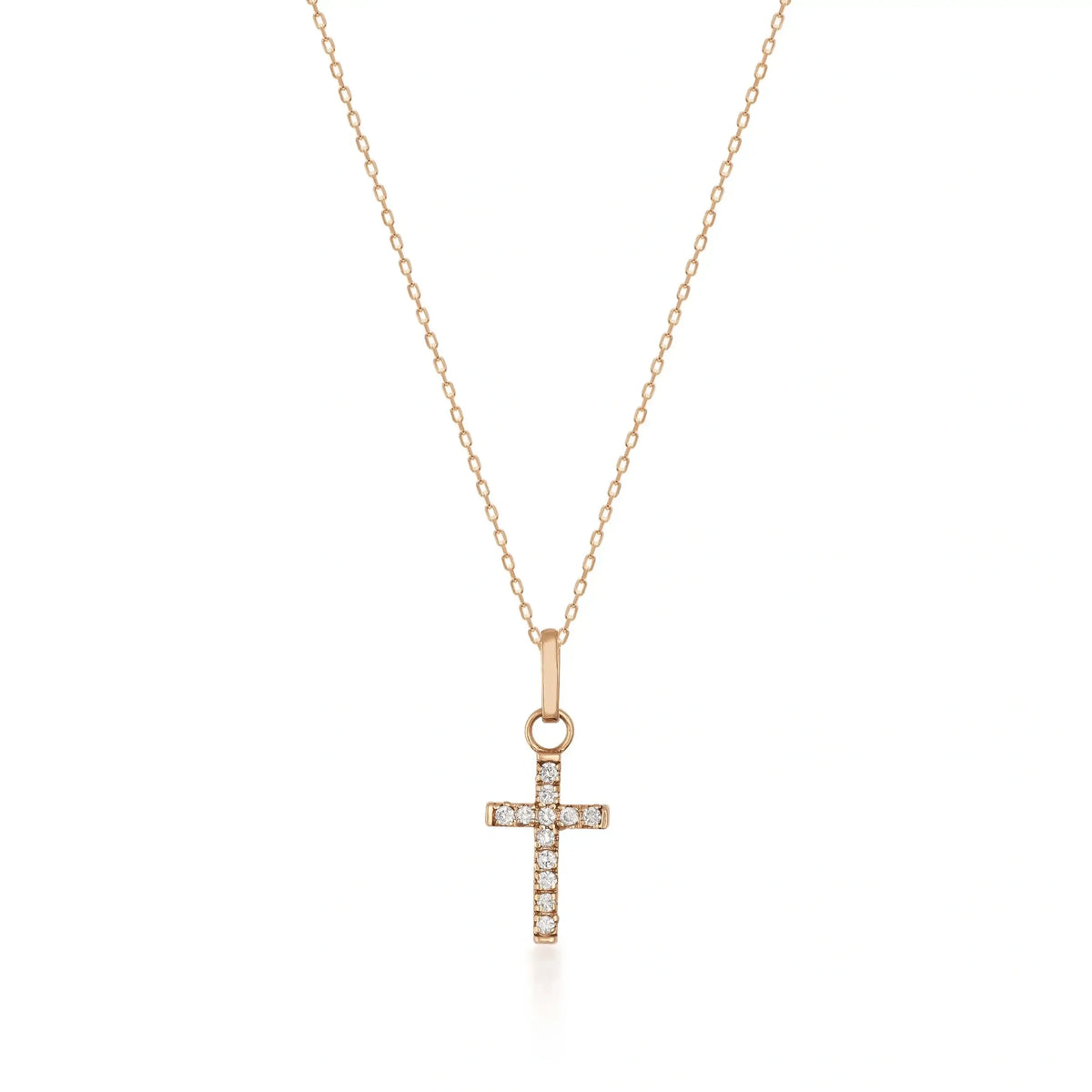 14K rose gold dainty CZ cross necklace on white background