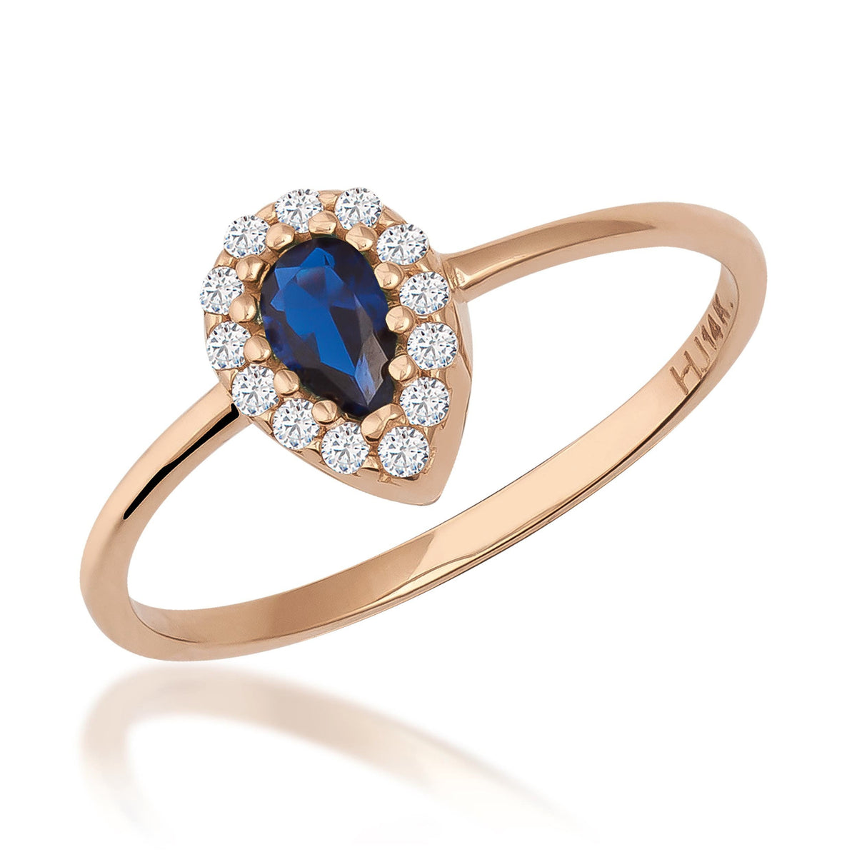 Pear halo ring in 14K rose gold with lab-grown sapphire and CZ halo on white