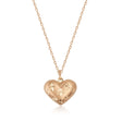 Collana cuore bombato con stella incisa in oro rosa 14kt su sfondo bianco