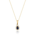 Collier pendentif halo saphir poire de synthèse en or jaune 14 carats sur fond blanc
