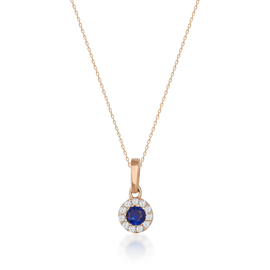 Collier halo saphir rond de synthèse en or rose 14 carats sur fond blanc