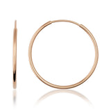 Orecchini a cerchio endless in oro rosa 14kt, vista laterale e frontale su sfondo bianco
