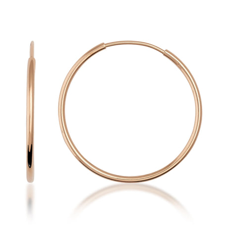 Créoles sans fin en or rose 14 carats, vue de côté et de face sur fond blanc