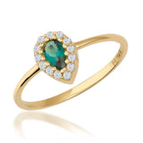 Pear halo ring in 14K yellow gold with lab-grown emerald and CZ halo on white