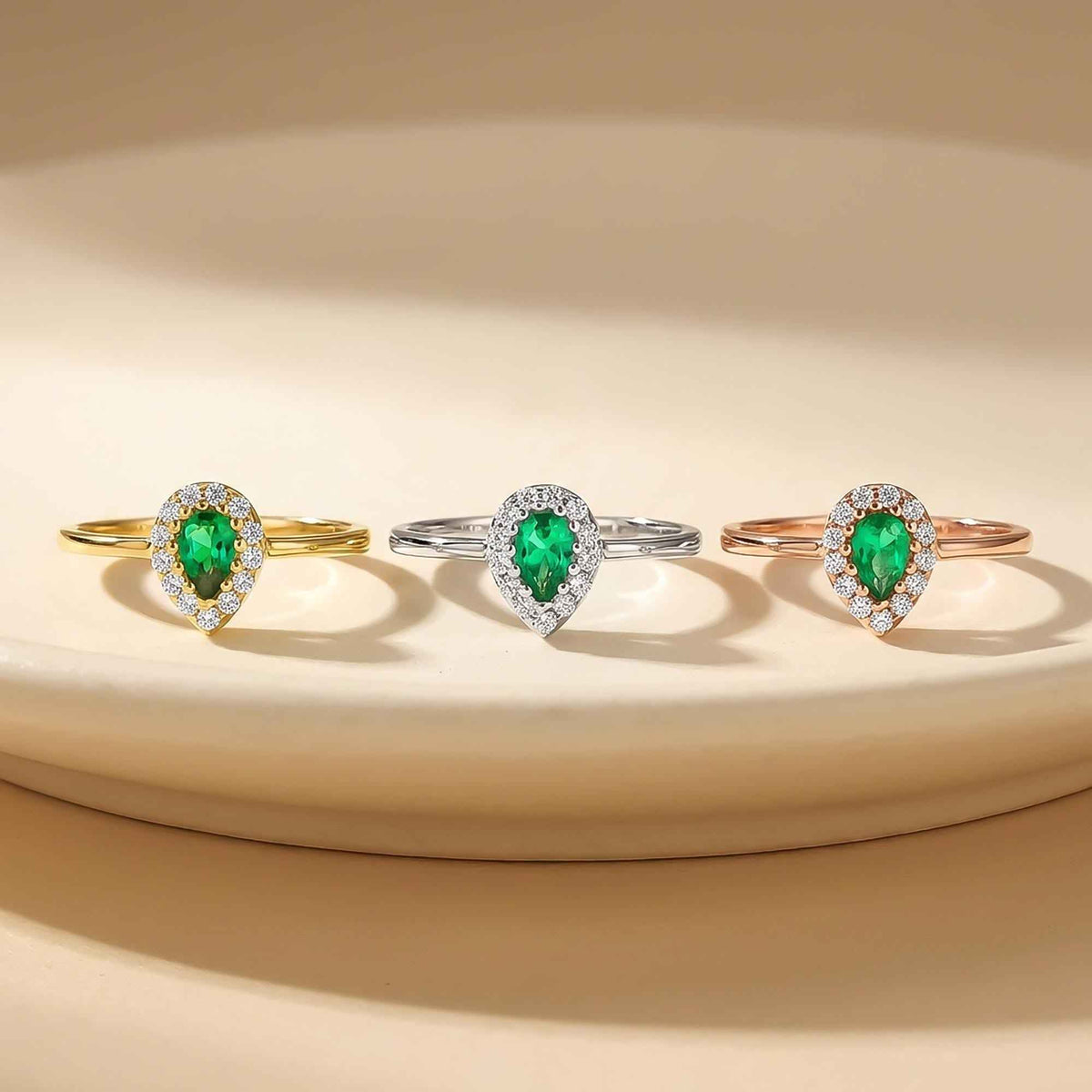Lab-grown emerald pear halo rings in 14K yellow, white and rose gold