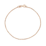 Pulsera de cadena de bolitas en oro rosa de 14 quilates sobre fondo blanco