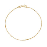 Pulsera de cadena de bolitas en oro amarillo de 14 quilates sobre fondo blanco